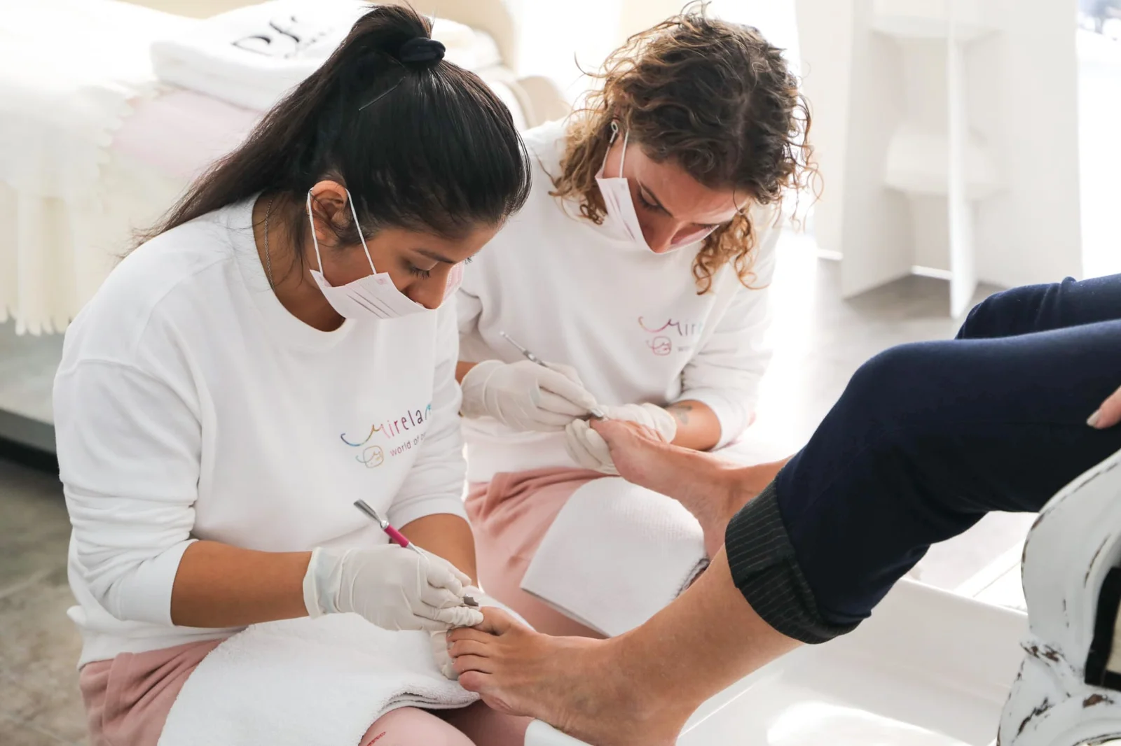 Professional pedicurist performing a relaxing foot care and nail grooming session